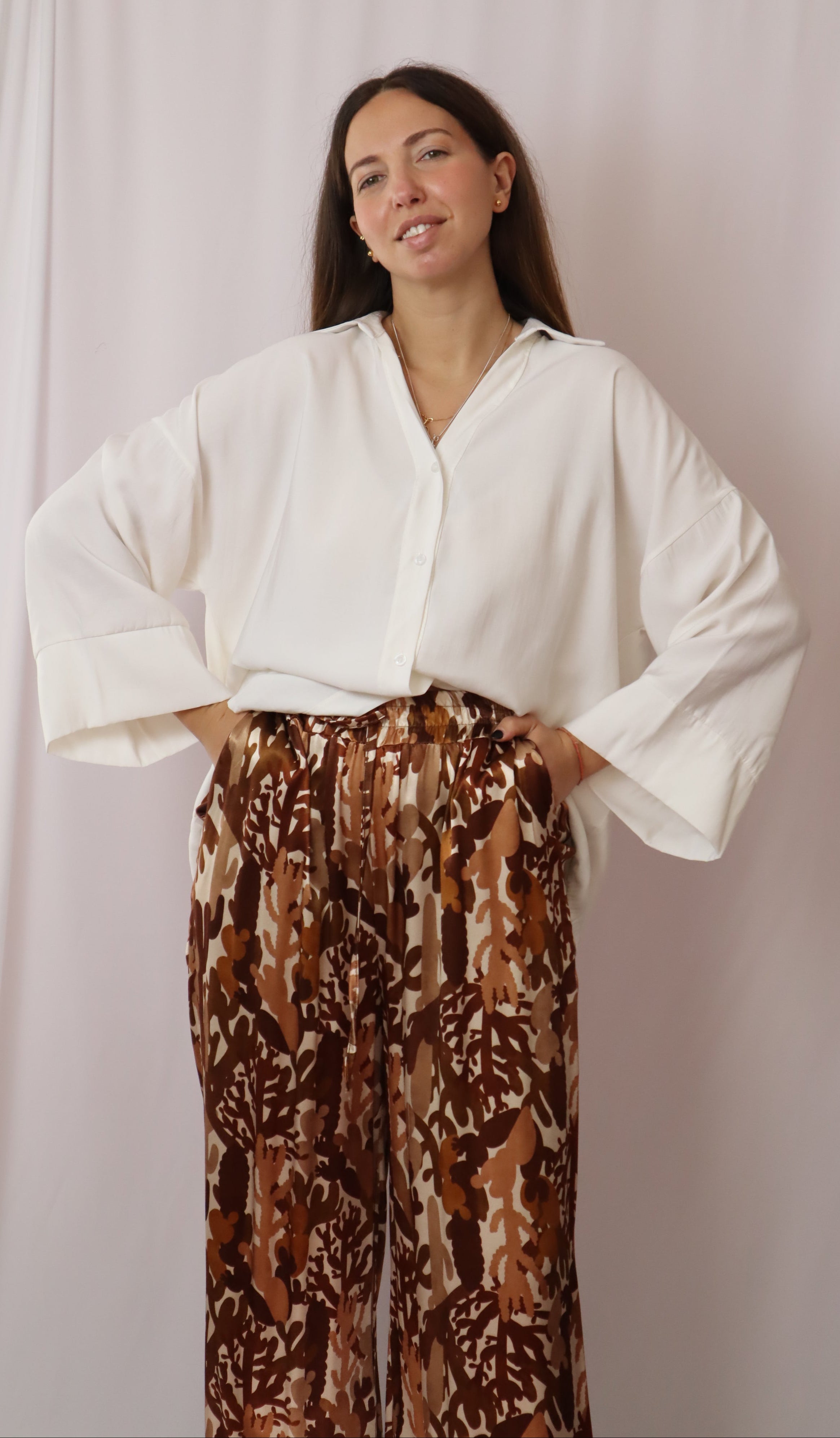 Calças estampadas castanhos