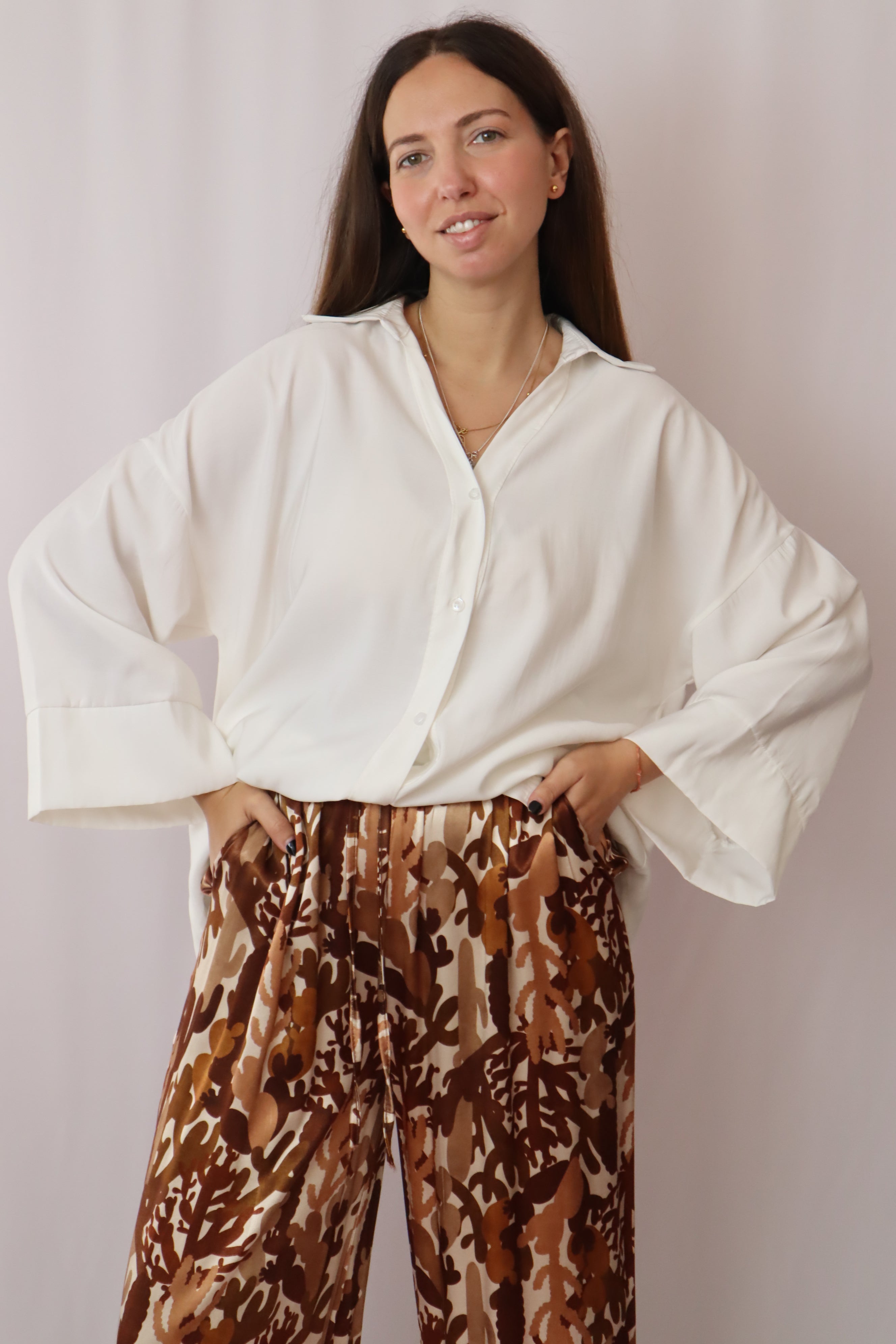 Calças estampadas castanhos