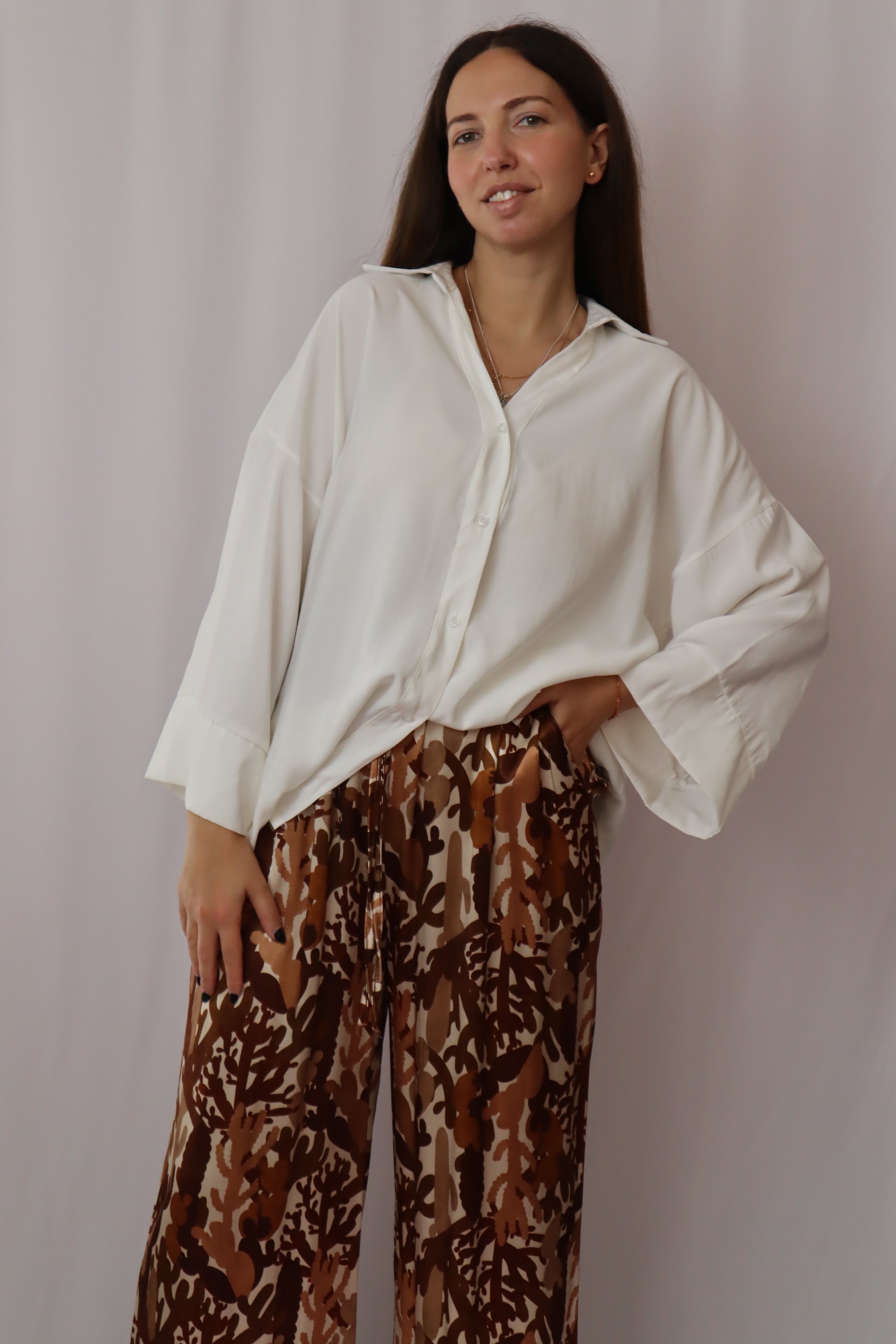 Calças estampadas castanhos