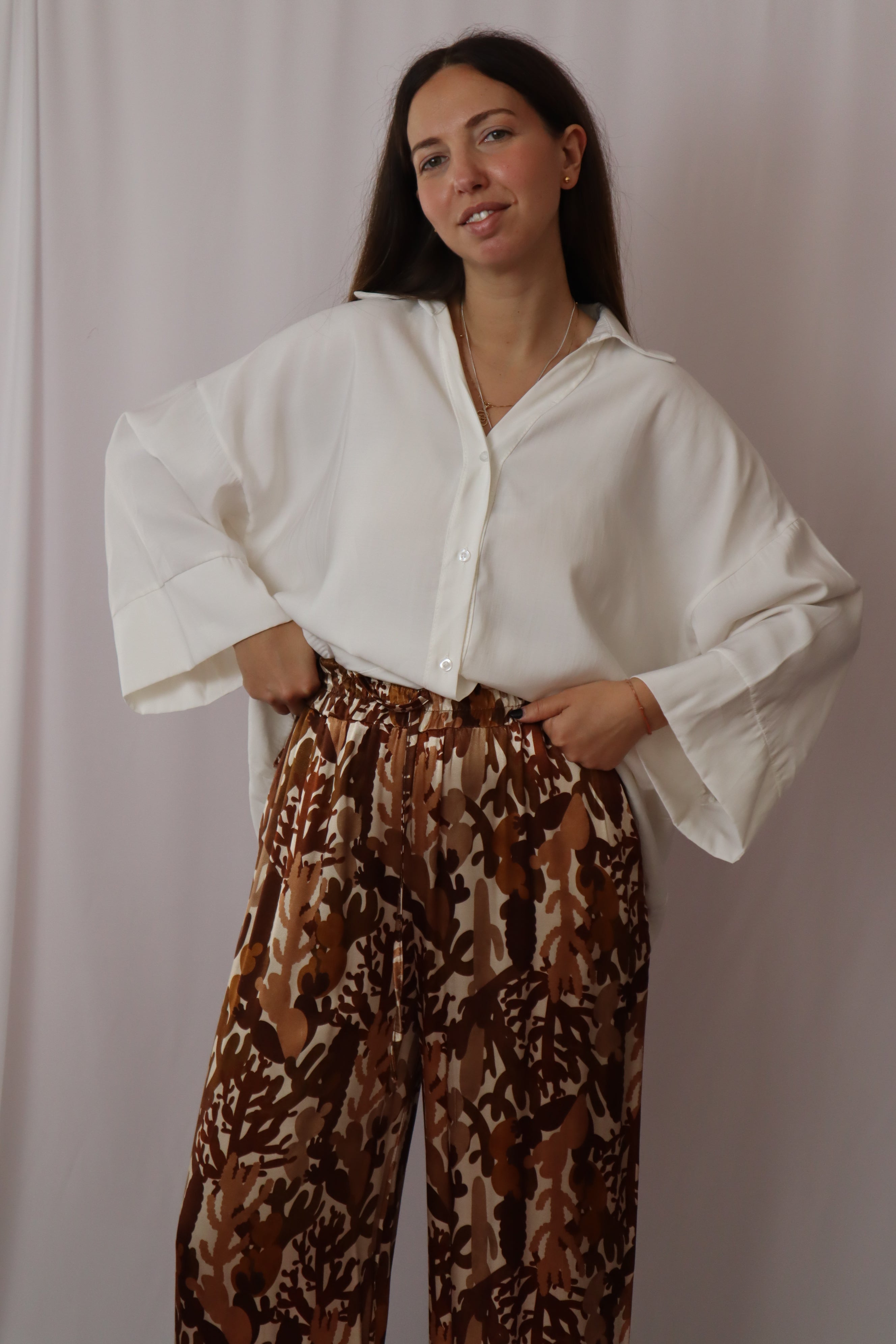 Calças estampadas castanhos